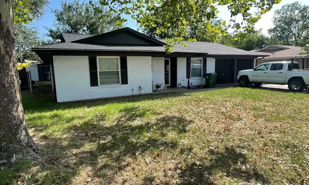 Professional roofing crew working on a residential roof in Winthrop